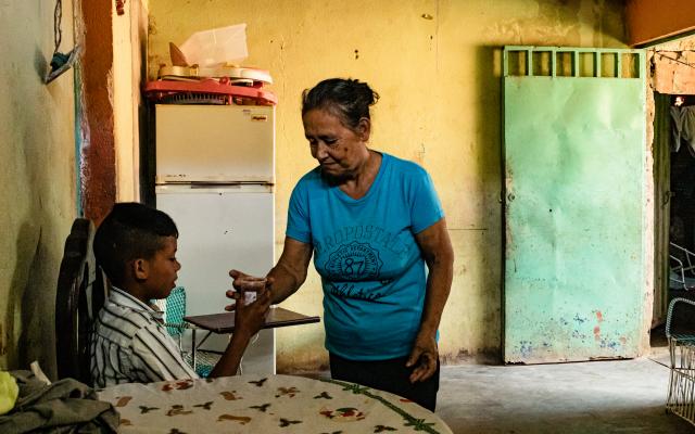 When her husband emigrated, Clavel* stayed in charge of her 11-year-old grandson. On many occasions she has had to stop eating in order to feed him.
